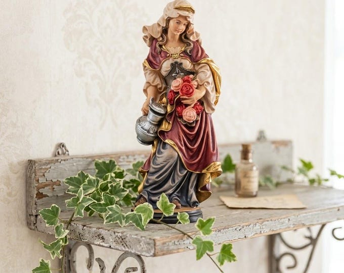 Sculpture of Saint Elizabeth with roses carved in Valgardena wood, hand-decorated and handcrafted in Italy.