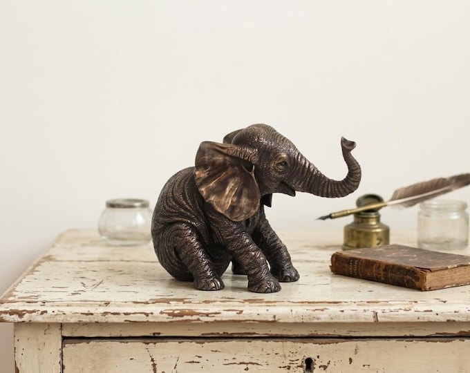 Classical sculpture of a seated elephant, 11 cm (4.33 inches) in bronzed resin marble, handcrafted in Italy
