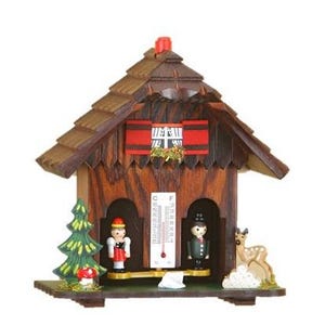 May include: A wooden cuckoo clock in the shape of a house, featuring a brown shingled roof and a red accent above the window. The clock has two small figurines, a thermometer, and a deer figurine. The clock is decorated with a green tree and a mushroom.