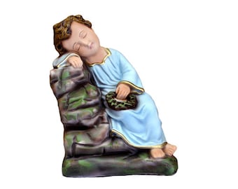 Statue of the Child Child dormant in hand-decorated resin of Italian artisan production