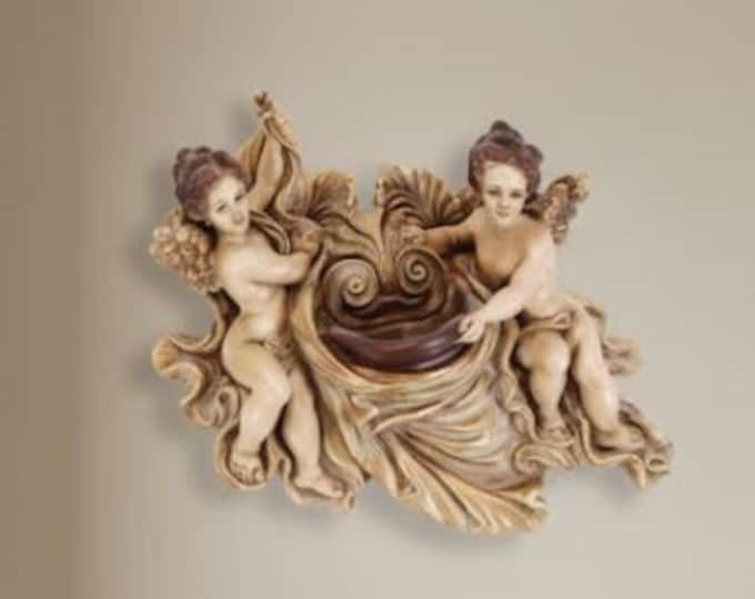 Wall angels cm 29 X 28 (11,41 X 11,02 inches) in resin hand decorated, artisanal production for exteriors and interiors