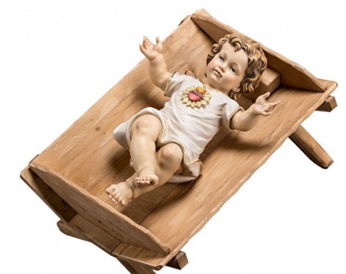 Sculpture statue of baby Jesus with Heart in cradle, carved in Valgardena wood and hand-decorated, of Italian artisan production