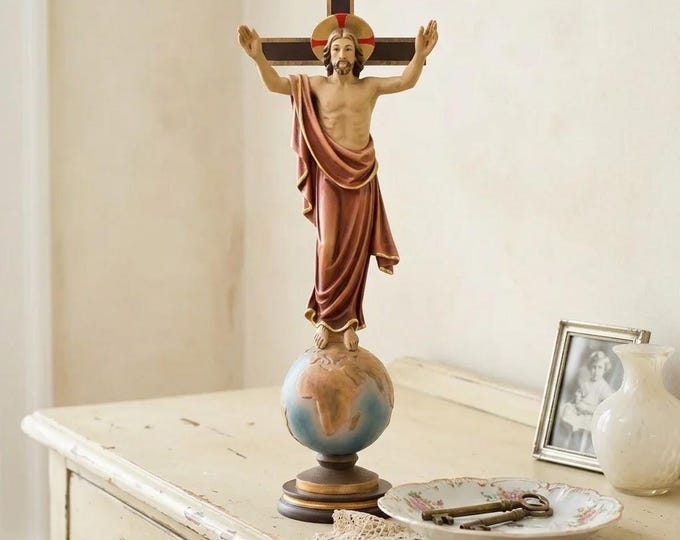 Sculpture of the Risen Christ on the globe, carved in Valgardena wood and hand-decorated, Italian artisan production.