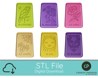 May include: Six colorful cookie cutters with Spanish text, including "El Cotorro", "El Jorracho", "La Rosa", "La Araña", "El Sol", and "El Diabuno".