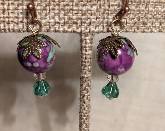 Purple, white, and green flower earrings