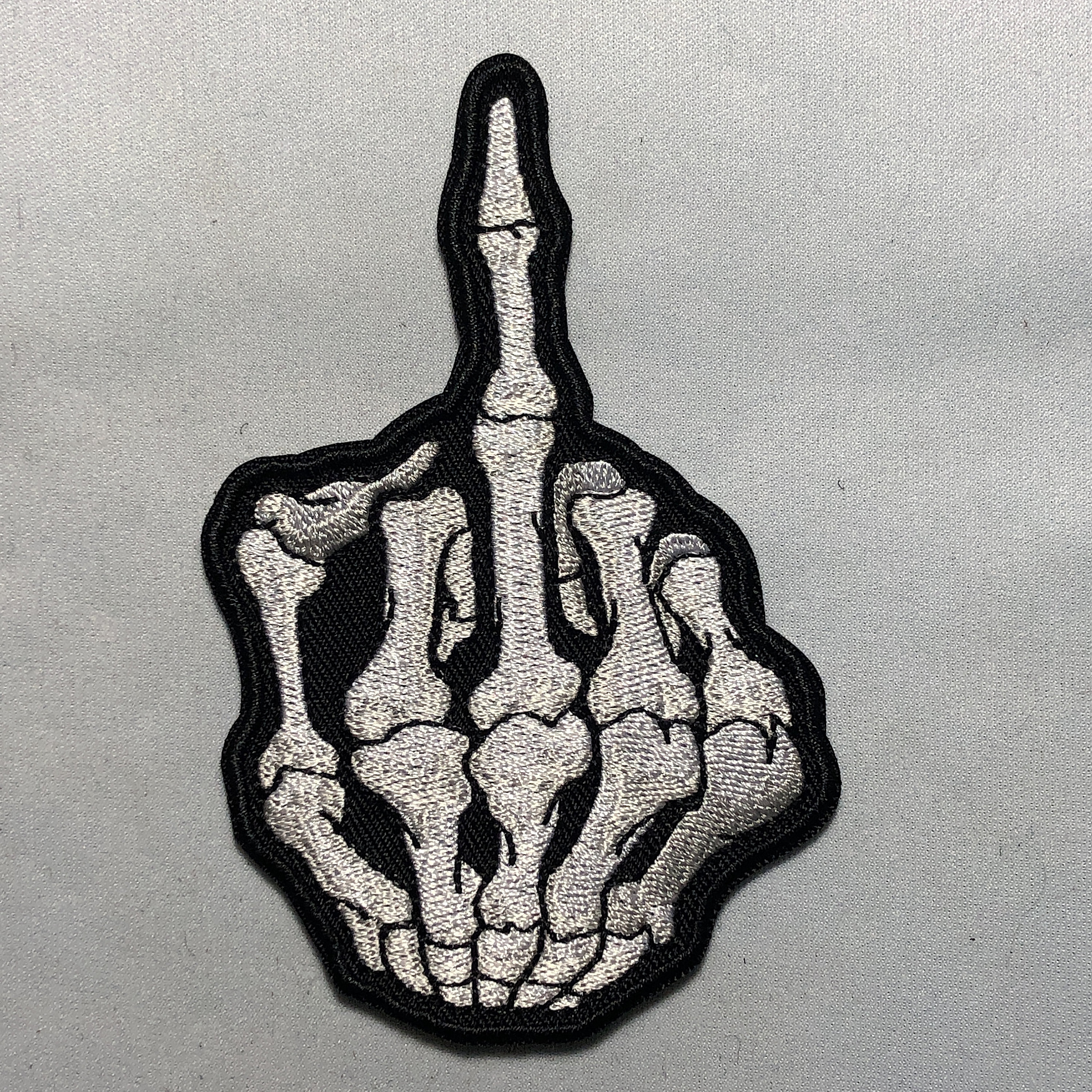La Mano Di Scheletro Mostra Il Dito Medio Illustrazione Vettoriale