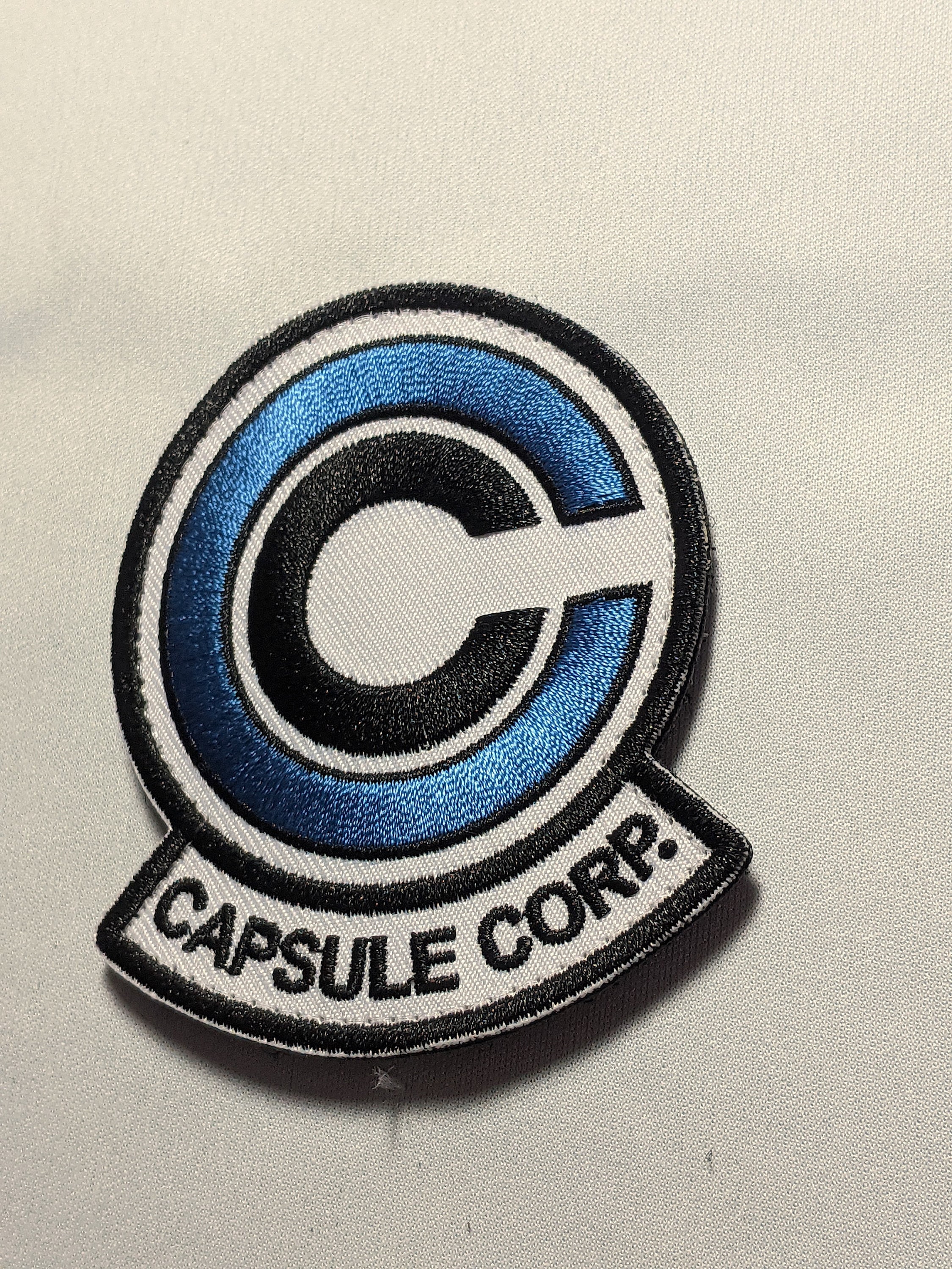 Capsule corp deals sweater