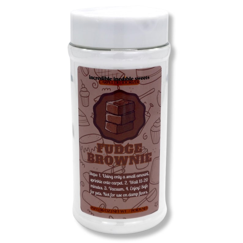 May include: A clear plastic jar with a white lid, labeled "Fudge Brownie." The label features a brown graphic of a brownie and instructions for use. The jar contains a white powder and is designed to be sprinkled on carpets.