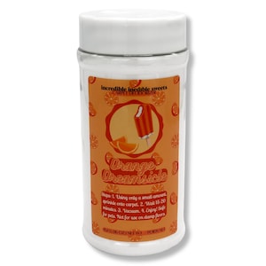 May include: A white plastic container with a white lid. The label features the text "Orange Dreamsicle" and an illustration of an orange creamsicle. The label also includes instructions for use and the text "Incredible inedible sweets CARPET DEODORIZER".