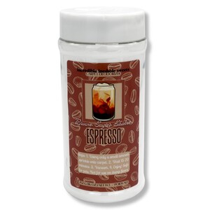 May include: A white plastic container with a brown label featuring coffee beans and a coffee drink illustration. The label reads "Brown Sugar Shaker ESPRESSO" and "Carpet Deodorizer". The container is filled with a powder.