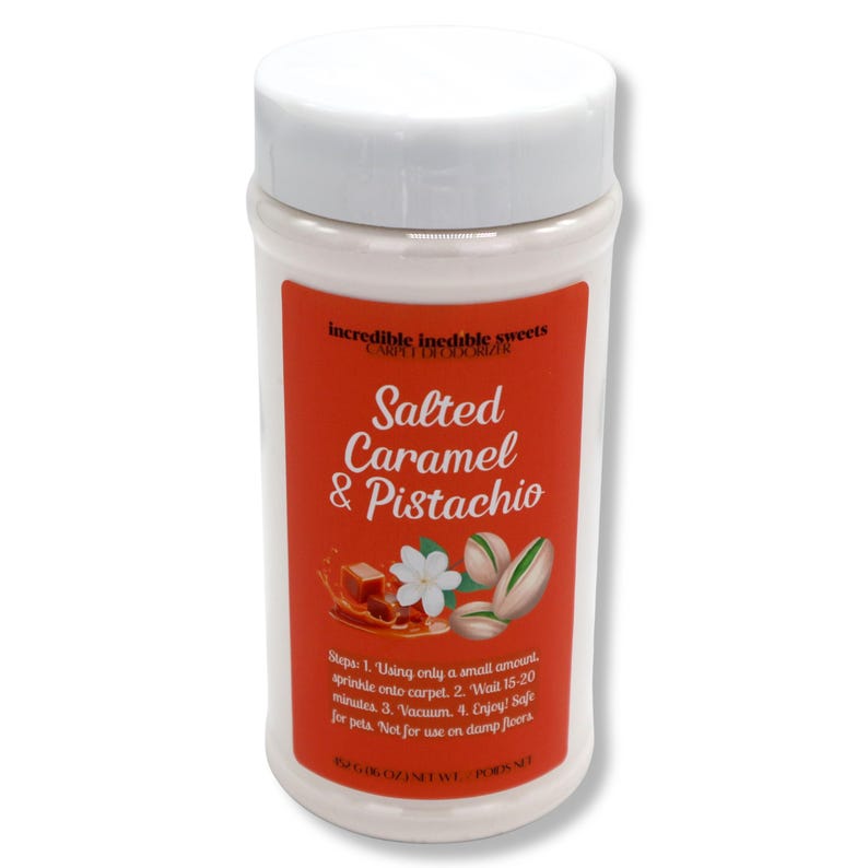 May include: A white plastic container with a white lid. The label is orange with the text "Salted Caramel & Pistachio". The label also includes images of caramel, a flower, and pistachios. The container is 6 oz.