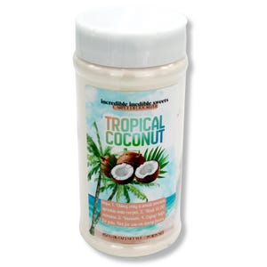May include: A white cylindrical container of carpet deodorizer with a white lid. The label features a tropical scene with coconuts and palm trees. Text on the label reads "Tropical Coconut" and "Incredible Inedible Sweets". The net weight is 6 oz.