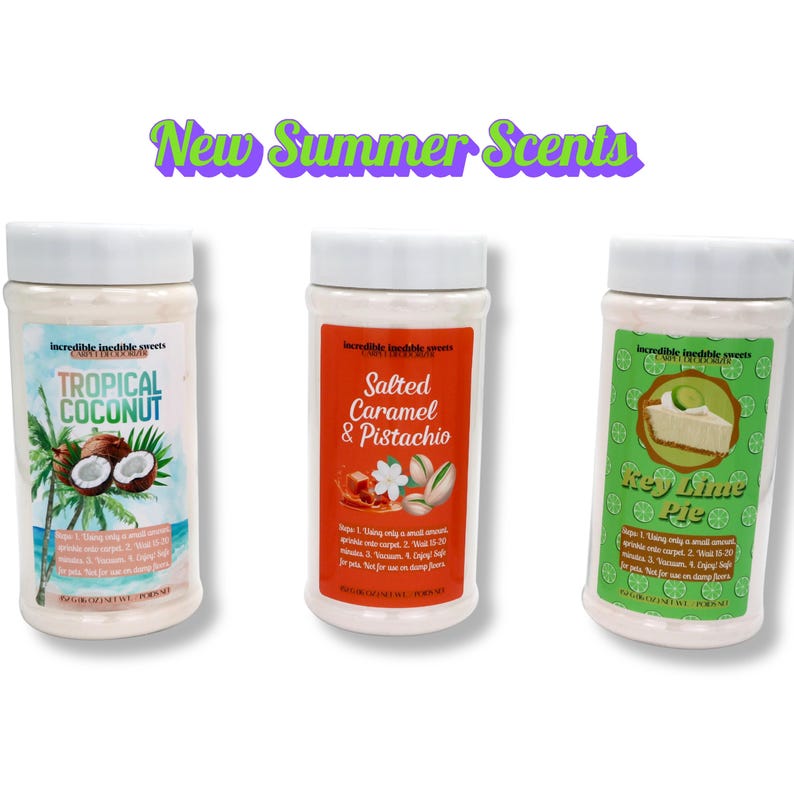 May include: Three white jars with white lids, each labeled with a different scent: Tropical Coconut, Salted Caramel & Pistachio, and Key Lime Pie. The jars have colorful labels with images of coconuts, pistachios, and key lime pie. The text "New Summer Scents" is at the top.