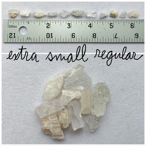 Top photo is of all of the extra small regular stones lined up against a ruler (in inches). Bottom photo is of all of the extra small regular stones lined up next to each other on a white background.