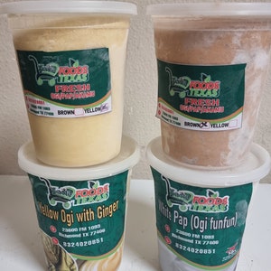 May include: Four containers of frozen Ogi, a traditional African breakfast porridge. The containers are labeled "Nasha Foods Texas Fresh Ogi/Pap/Akamu" and include the flavors "Yellow Ogi with Ginger" and "White Pap (Ogi funfun)".