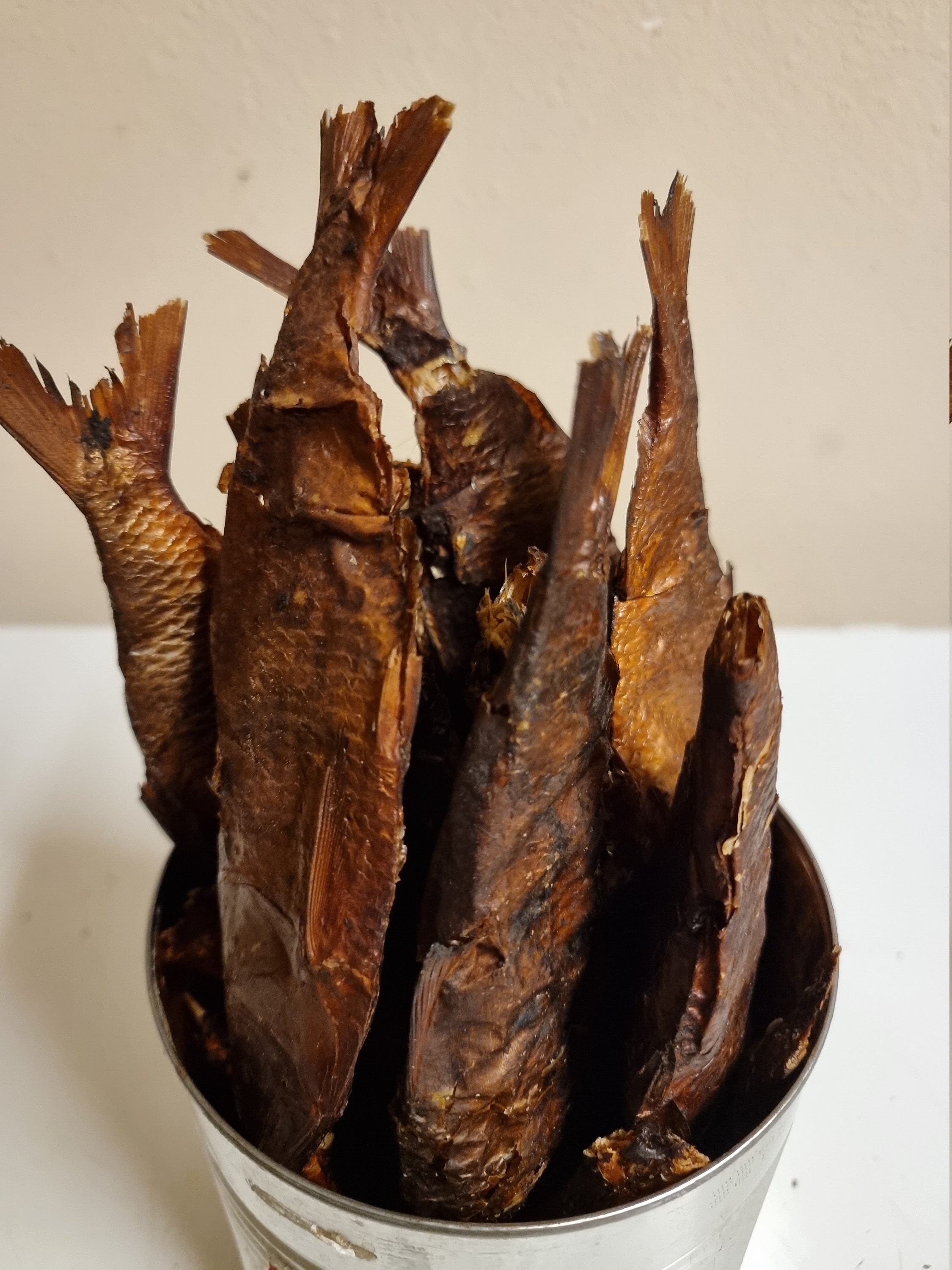 Many dried fish called stockfish for sale at european market Stock