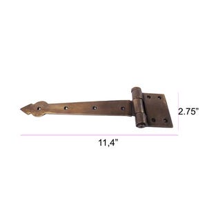 May include: A bronze-colored gate hinge with a decorative arrow-shaped end. The hinge measures 11.4 inches long and 2.75 inches high. It has a rectangular mounting plate with screw holes and a cylindrical hinge joint.