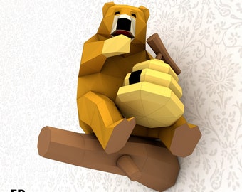 May include: A papercraft model of a brown bear sitting on a branch, holding a yellow honeycomb. The bear has a wide open mouth and is looking up. The model is made of paper and is designed to be assembled.