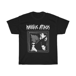 May include: Black t-shirt with a white graphic of a band called "Massive Attack". The graphic features three people in a square frame.