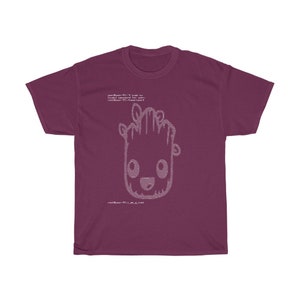 May include: A maroon t-shirt with a white graphic of a cartoon character. The graphic is made up of computer code. The text on the shirt reads "your-user-id:1 code to login! root:password for user: rootUser-ID:1,a.k.a.root"