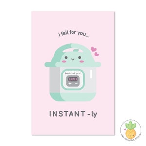 May include: A pink card with a cartoon illustration of a green Instant Pot with a happy face and the text "i fell for you..." and "INSTANT-ly". The Instant Pot has a digital display that reads "LOV3".