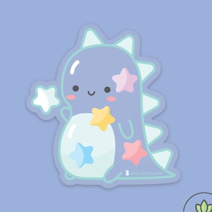 May include: A light blue dinosaur with a light blue belly and a light blue star on its belly. The dinosaur has a pink star on its head and a yellow star on its back. The dinosaur is surrounded by stars and the text "tiny pineapple" is at the bottom of the image.
