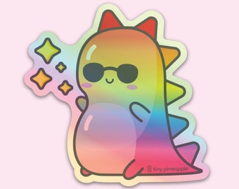 Holographic shiny rainbow dinosaur vinyl sticker— Tiny Pineapple Studio (sparkles squishy dino cool cute kawaii nerdy happy)