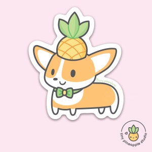 May include: A sticker featuring a cartoon corgi wearing a pineapple hat and a green bow tie. The corgi is orange and white with black eyes and a smiling face. The sticker has a white border and the words "tiny pineapple studio" are printed on the bottom.