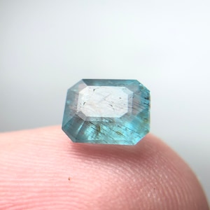 Rare Needles Like Crystal in Sky Blue Apatite top cut gemstone from Africa