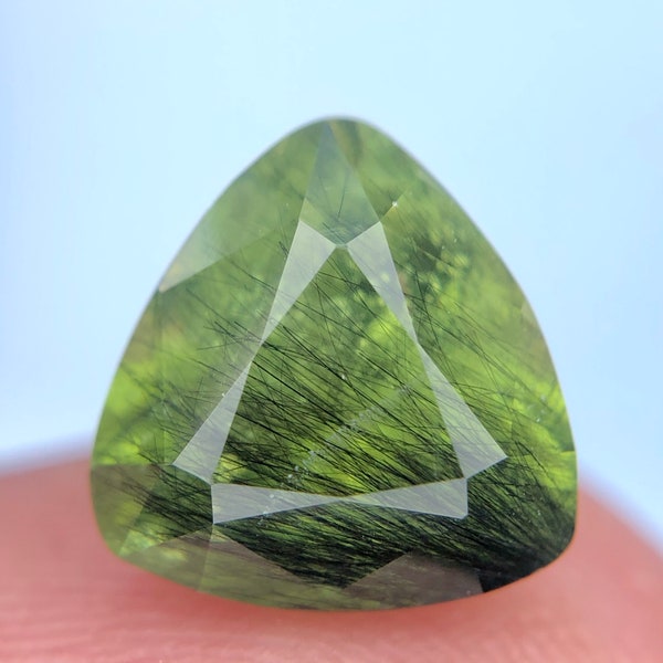 Rare Ludwigite needles in Peridot top Faceted Gemstone from Pakistan