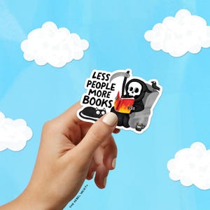 May include: A sticker featuring a cartoon Grim Reaper reading a book with the text "LESS PEOPLE MORE BOOKS." The Reaper is seated in a chair with a black cat and a raven. The background is a blue sky with white clouds.