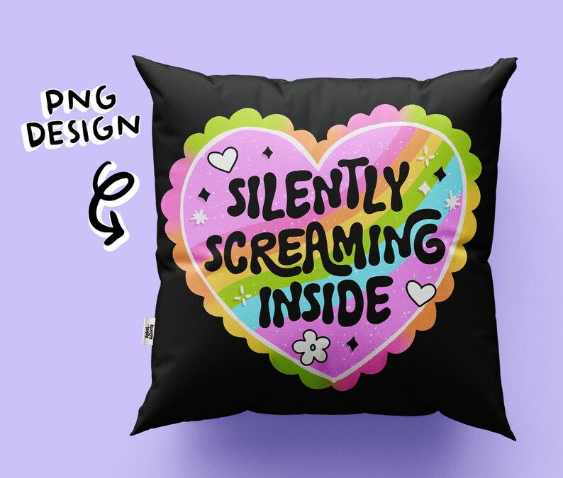 May include: Black pillow with a rainbow heart design that says "Silently Screaming Inside".