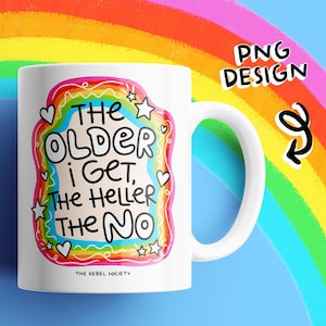 May include: A white ceramic mug featuring a colorful rainbow-themed graphic with the text 'THE OLDER I GET, THE HELLER THE NO' in black hand-lettered font. The design includes small stars and hearts, with 'THE REBEL SOCIETY' printed at the bottom.