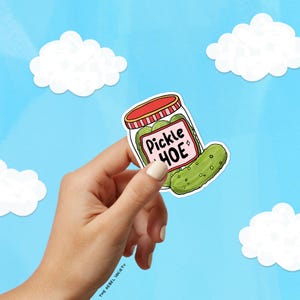 May include: A sticker of a jar of pickles with the text "Pickle Hoe" in pink and white lettering.