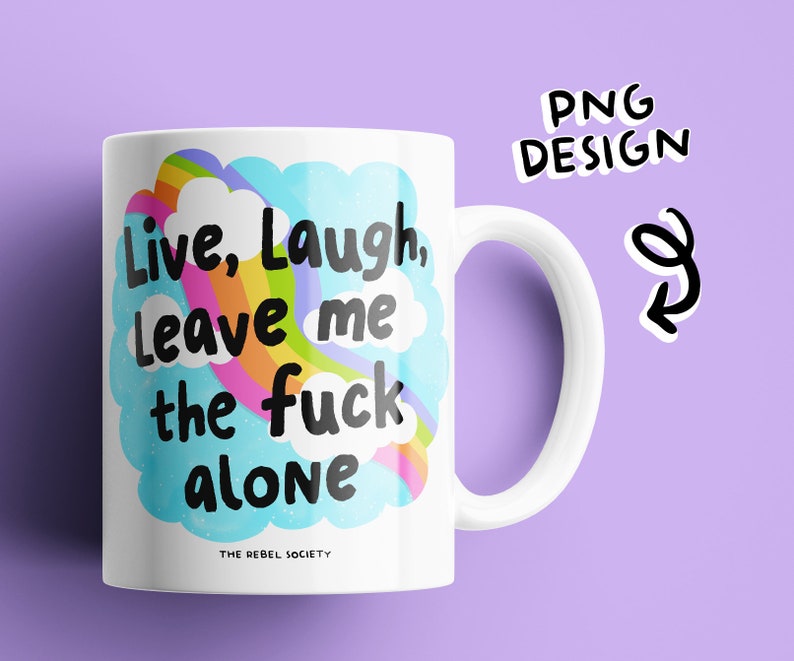May include: White ceramic mug with a rainbow and clouds design. The text on the mug reads "Live, Laugh, Leave me the fuck alone." The text "The Rebel Society" is printed in smaller font below the design.