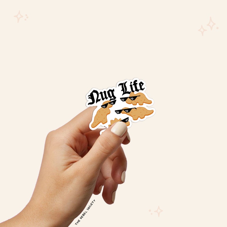 May include: A sticker with a group of chicken nuggets wearing sunglasses and the text "Nug Life" in a black gothic font.