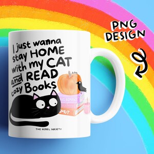 May include: White ceramic mug with a whimsical design. The mug features a black cat, a pumpkin, and stacked books. Text on the mug reads "I just wanna stay HOME with my CAT and READ cozy Books." The mug has a white handle and the words "PNG DESIGN" are also visible.