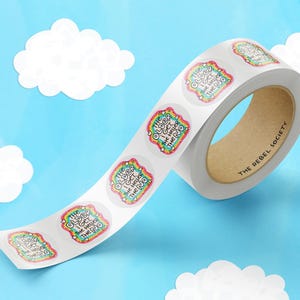 May include: A roll of circular adhesive stickers featuring a colorful, rainbow-patterned border and the text THE OLDER I GET, THE HELLIER THE NO. The stickers are arranged in a continuous strip on a white backing, with a brown cardboard core.