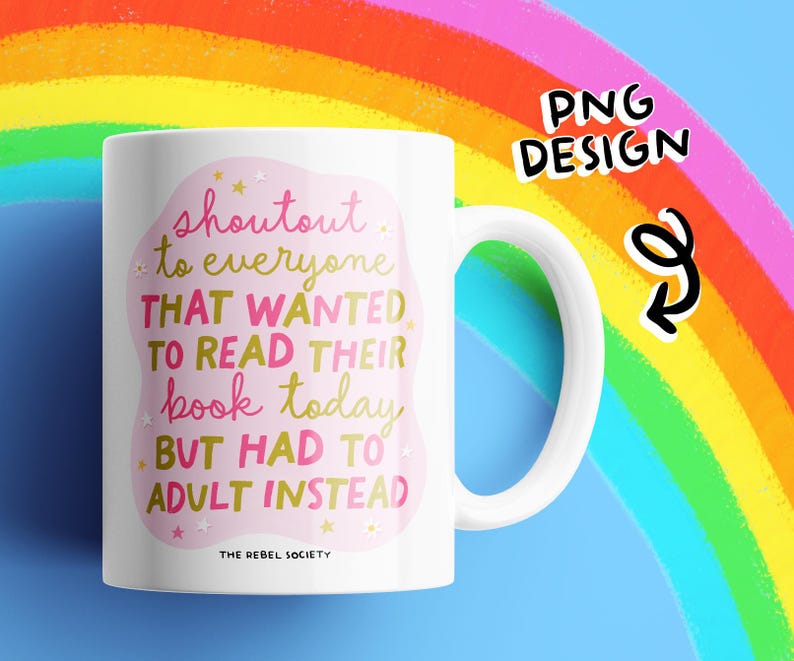 May include: White ceramic mug with a curved handle. The mug features the text "shoutout to everyone THAT WANTED TO READ THEIR book today BUT HAD TO ADULT INSTEAD" in pink and gold lettering. The background is a rainbow.