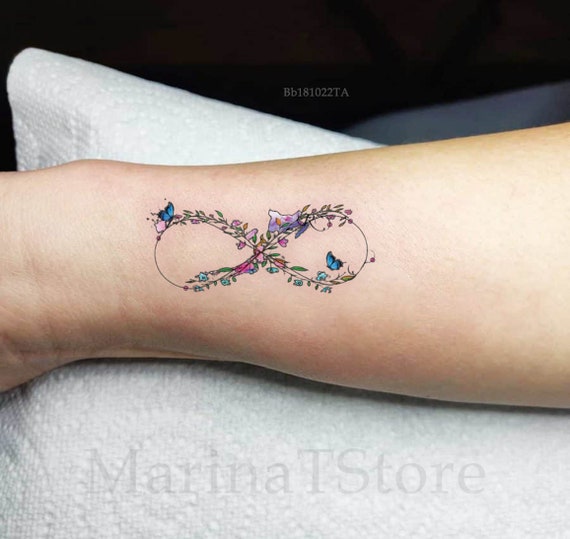 Infinity tattoo design ♾️👉 • Swipe 👉 Tattoo by @gaurav_patil77 For  appointment No.7775888223 #tattoo #tattoos #tattooart ... | Instagram