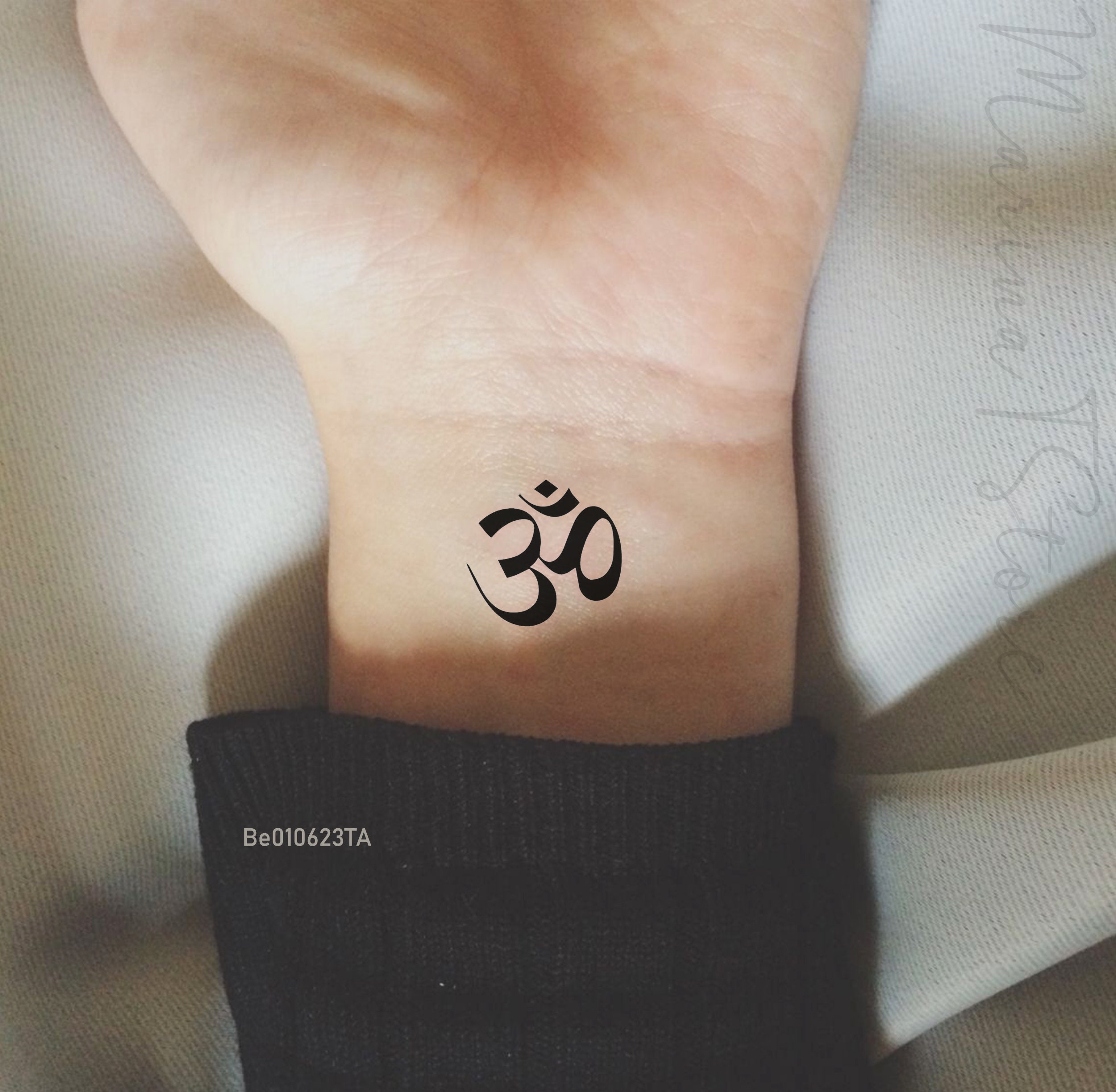 Spiritual forearm sleeve tattoo centred around the Sanskrit Om symbol for  breathe tattoo idea | TattoosAI