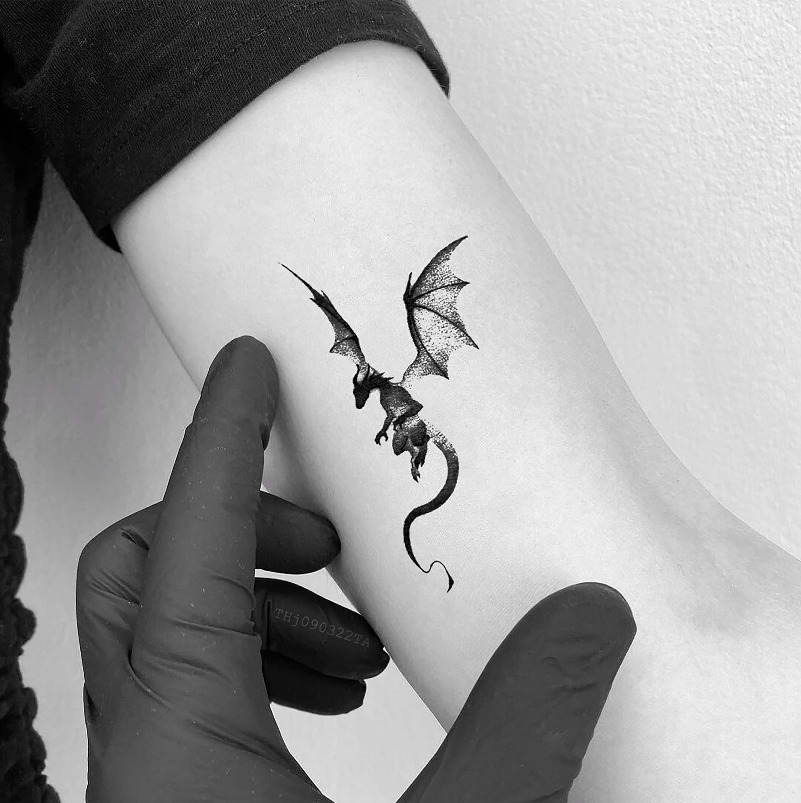 small blue dragon flying, forearm tattoo, dragon tattoos for women, blurred  background | Dragon tattoo for women, Small dragon tattoos, Dragon tattoo  designs