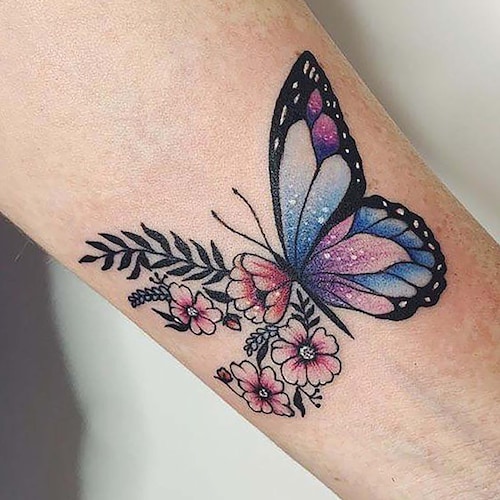 Half butterfly half flower tattoo done on the tricep