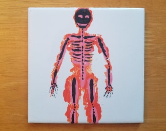 Halloween-Gemälde eines grinsenden Skeletts in Pink, Orange und Schwarz auf einer 10 x 10 cm großen Fliese