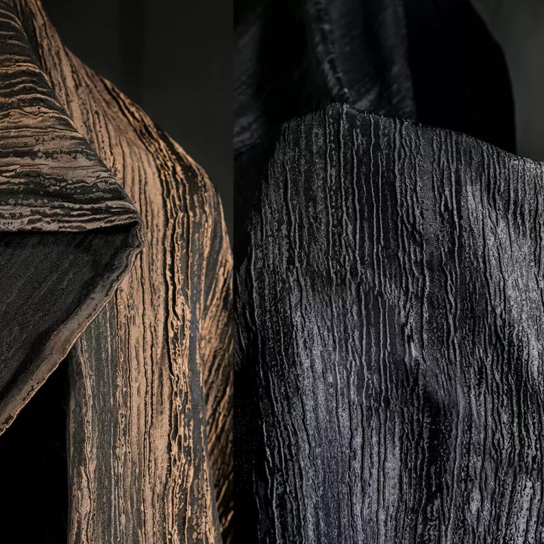 May include: Close-up of two sections of fabric. One section is a dark brown with vertical lines, and the other is black with vertical lines. The fabric has a textured, rippled appearance, suggesting a luxurious material.