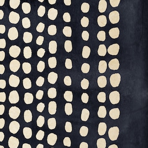 May include: Abstract art print featuring a dark navy background with vertical rows of off-white, irregular oval shapes. The design has a textured appearance, creating a visual contrast between the dark and light elements. The artwork evokes a sense of depth and pattern.