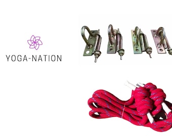 May include: Four metal ceiling hooks with a red rope. The hooks are designed for hanging a yoga swing. YOGA-NATION is printed on the white background.
