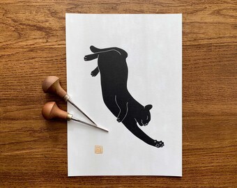 Stretching cat #3 hand printed lino cut print in black ink | Handmade original blockprint art. A great gift for cat lovers! By Megan Abel