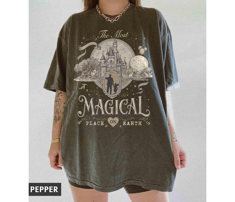 May include: A white ceramic mug with a black handle and the text "But First, Coffee" in a bold, black font. The mug is set against a blurred background, suggesting a cozy setting.