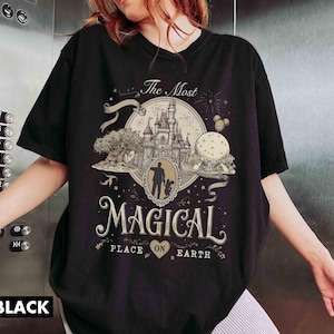 May include: A white ceramic mug with a black handle and the text "But First, Coffee" in a bold, black font. The mug is set against a neutral background, highlighting its simple design.